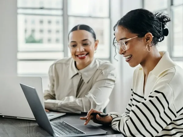 Two women working at table