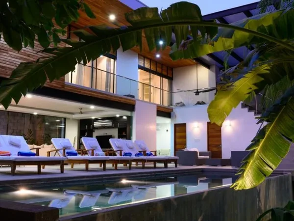 Luxury home with pool by sunset